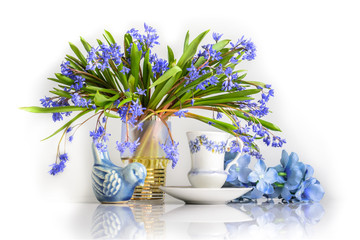 still life with spring flowers and a bird in blue colors