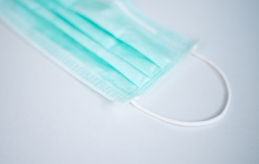 green mask on white background.