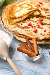 Delicious Russian pancakes with sour cream and honey cooked for Shrovetide celebration
