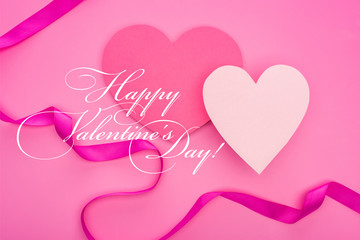 top view of empty paper hearts with ribbon isolated on pink with happy valentines day illustration