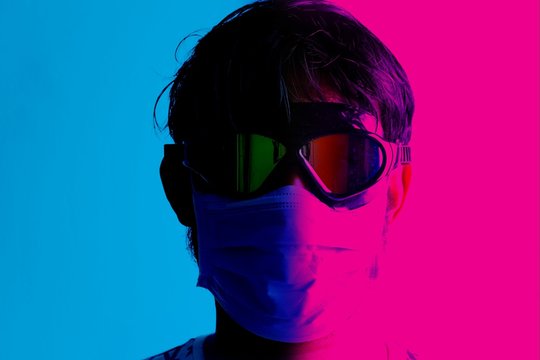 Neon effect picture of man wearing medical mask for viral or pandemic disease