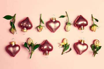 Decorative hearts and little roses on a pink background.
