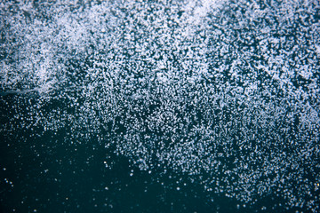Methane Bubbles in the Baikal Ice.ice and cracks on the surface of Lake Baikal, Winter.Top view. Winter texture.Air bubbles in ice.Baikal ice. Crystal clear drinking water. 