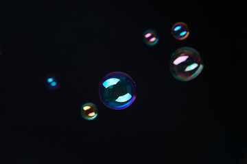 Naklejka premium Beautiful bubbles on black background