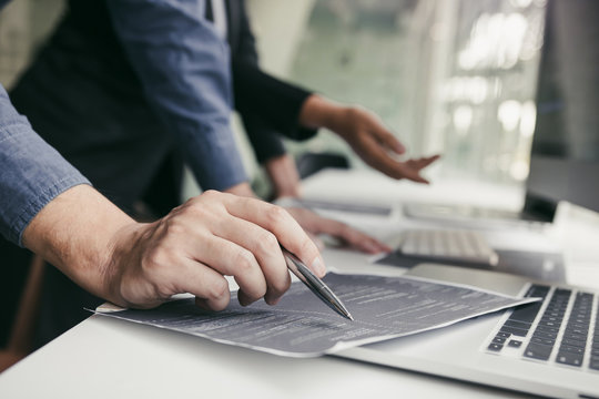 Developing programming and coding technologies working in a software engineers developing applications together in office.