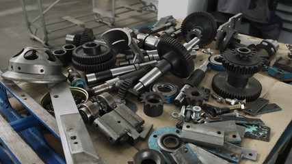 Wooden table with details and tools from outer diameter grinder