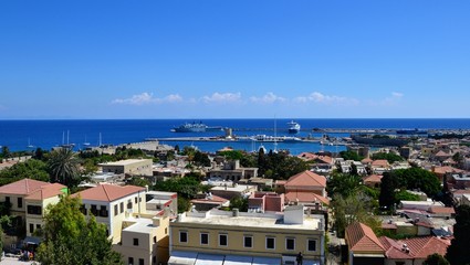 Rhodes, Greece. Aerial panoramic view, panorama of Rhodes town and sea view with Mandraki harbor with huge ships and boats