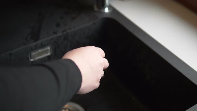 Woman washing hands under flowing water from tap in slow motion 180fps