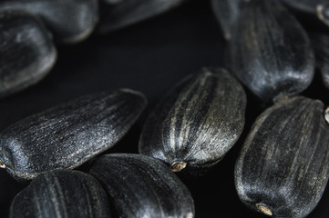 Sunflower seeds in  macro on black background