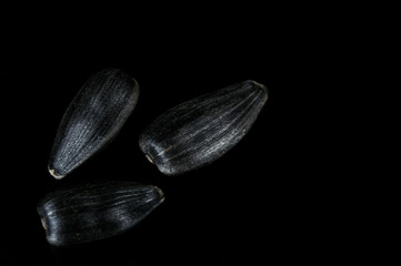 Sunflower seeds in  macro on black background
