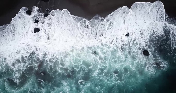 Aerial view of a beach in stormy seas 