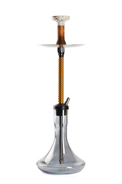 Modern hookah with a metal top with a gold decorative mesh, an openwork bowl for Shisha and a transparent flask with a light mirror effect, isolated on a white background with a light shadow.