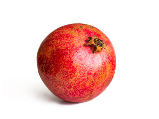 Ripe red pomegranate on a white background