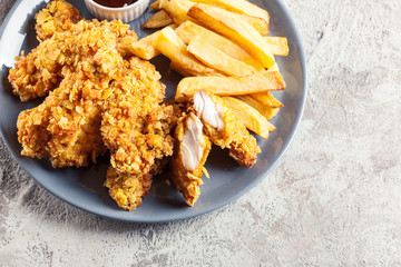 Chicken strips in cornflakes breadcrumb