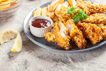 Chicken strips in cornflakes breadcrumb