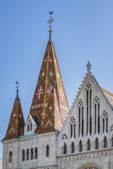 Fototapeta na wymiar Matthias Church (Church of Our Lady of Buda) - Roman Catholic church located in Budapest, Hungary, in front of Fisherman's Bastion - one of the landmarks of the city. 