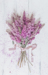 bouquet of pink flowers on a white background. top view