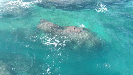 Relax contemplating the breaking of the waves and the mountainous horizon