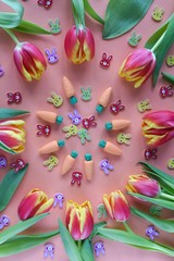 Easter pattern of tulips, carrots and small rabbits