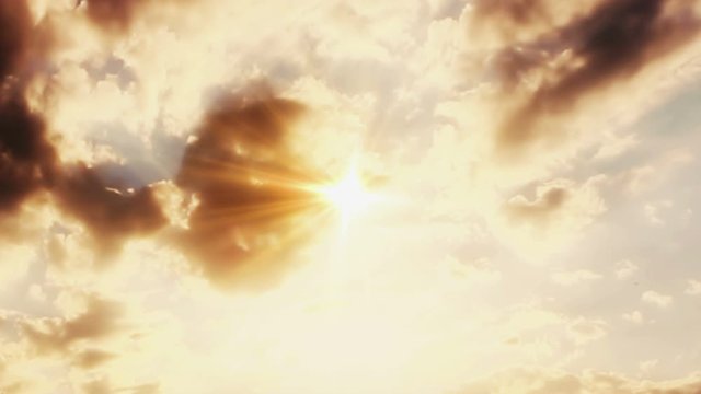 He is Risen Golden Text in the Sky with Sun Light and Moving Clouds. Jesus Christ , Happy Easter 