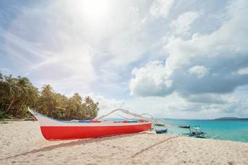 Beautiful landscape with tropical white sand beach with fishing boats. Siargao Island, Philippines.