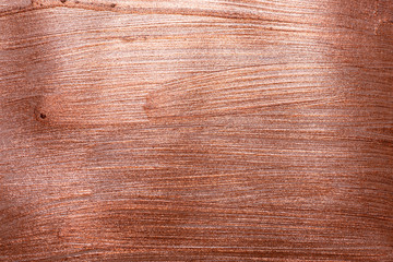 Red copper background texture with particles like scratches. Brush painted surface. Copper red gold pattern background.