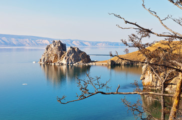 Baikal Lake. Beautiful spring landscape of Olkhon Islands. View of the natural landmark - Shamanka Rock on a sunny May day. Natural background