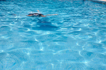 person swimming in the pool