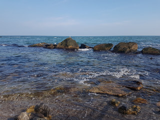 beautiful landscape with the azure sea with a stone coast