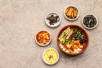 Traditional Korean spicy soup with kimchi, tofu, vegetables. Hot dish for healthy meal
