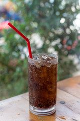 Clean carbonated water in glass. Red paper tube. Filtered by o2 system. Asian ground