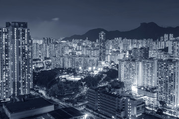 Lion Rock Hill and high rise residential building in Hong Kong city at night