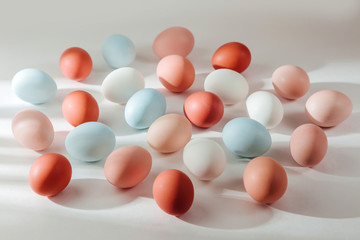 Natural Colored Eggs with sunlights. Compositions in pastel colors. Easter consept.  Flat lay, top view