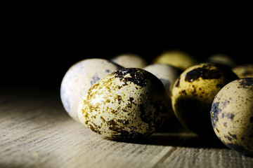 quail eggs on a black background
