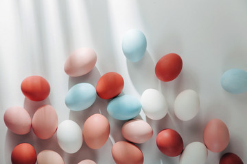 Natural Colored Eggs with sunlights. Compositions in pastel colors. Easter consept.  Flat lay, top view