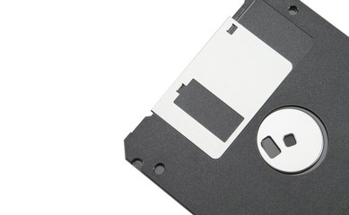 Part of an old black floppy disk for an FDD drive. Digital vintage drive. 1.44 megabyte retro data warehouse. Diskette on a white isolated background. Good quality close-up.
