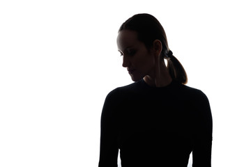 Fototapeta na wymiar black and white silhouette portrait of woman with her head down