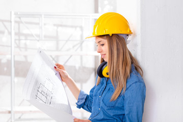 Attractive female builder or engineer on site