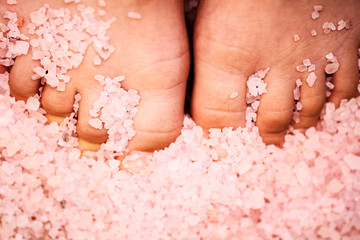feet in sea salt. skin care close-up