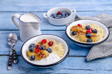 Wheat porridge with fruit and berries
