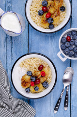 Wheat porridge with fruit and berries