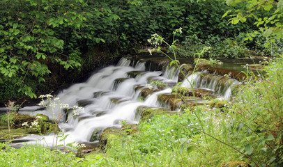 Small waterfall in Lathkill Dale Derbyshire