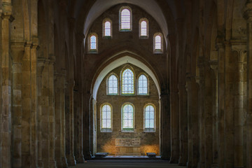 Ancient building of medieval French abbey with huge ceiling and windows. Abbey of Fontenay,...