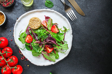 Healthy quinoa salad leaves mix (mix micro greens, cucumber, tomato, other ingredients) menu concept background. top view. copy space for text
