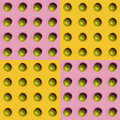 Limes pattern on yellow and pink background. Creative food concept. Flat lay