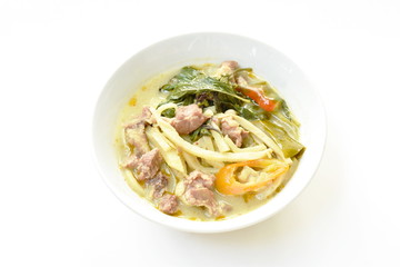 spicy boiled slice bamboo shoot with pork in coconut milk green curry soup on bowl