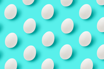 Easter white eggs on blue background.