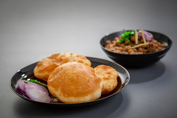 choley bhature is a dish originated initially in the northern part of the Indian subcontinent.  It is a combination of chana masala and bhatura, a fried bread made from maida.
