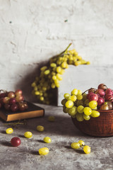Grapes on grey kitchen table with copyspace