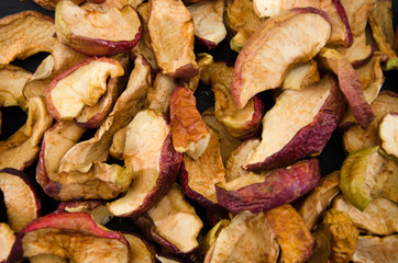 dried apples, background with slices of dried apples. Close-up.